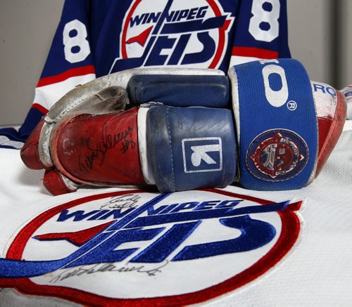 in pic signed Teemu Selanne  gloves , jersey  -- Jets Memorabila hockey event tickets  jerseys  - Photo Book Project - Wpg Winnipeg Jets Hockey Club - NHL National Hockey League return -  ( kgjets brings up all Wpg Jets recovered photos in Merlin new book project pics will have slug newjets ( 147 new photos added June 2011  -  for archive pics put in after june 7 2011) - ***These next Photos slugged newjets2 for photos afterJune 14 20011( ken gigliotti staff ) )  photos cannot be  published without written permission from the Winnipeg Free Press and credit must include  the Winnipeg Free Press / JUNE 29 2011 ( KEN GIGLIOTTI  / WINNIPEG FREE PRESS )  JUNE 29 2011-Must Creit Holliston Family collection