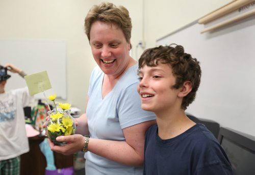Quinn smiles after giving his Grade six  Windsor School teacher Colleen Neil  a gift on the last day of School Thursday.  Story by Carolin Vesley, 2017 feature. June 29, 2011 (RUTH BONNEVILLE / WINNIPEG FREE PRESS)
