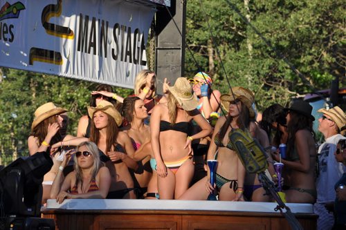 Countryfest, Dauphin, Manitoba - Eric Church fans wait for his show in the stage side hot tub. Bruce Leperre photo. July 02 2011.