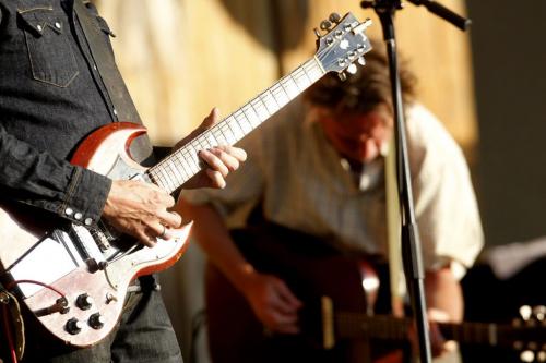 Winnipeg Folk Festival 2011. The second band playing opening night is the Jayhawks. Mark Olson belts it out in behind (out of focus) as Gary Louris's guitar in the forground . Rob Williams story. July 6, 2011 (BORIS MINKEVICH / WINNIPEG FREE PRESS) 110706