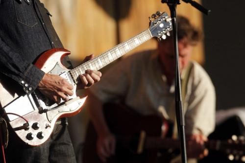 Winnipeg Folk Festival 2011. The second band playing opening night is the Jayhawks. Mark Olson belts it out in behind (out of focus) as Gary Louris's guitar in the forground . Rob Williams story. July 6, 2011 (BORIS MINKEVICH / WINNIPEG FREE PRESS) 010706