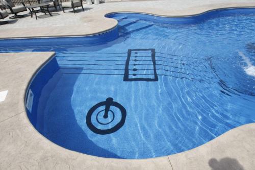 - in pic Todd Lewys story  Anola home with guitar shaped  pool -Todd Lewys story ( KEN GIGLIOTTI  / WINNIPEG FREE PRESS ) July 8 2011