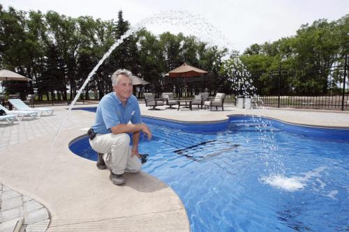 - in pic Aqua Tec 's Glen MacGillivary  at  Anola home with guitar shaped  pool his comapny installed - in pic - Todd Lewys story ( KEN GIGLIOTTI  / WINNIPEG FREE PRESS ) July 8 2011