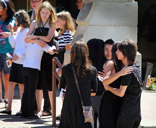 Brandon Sun Mourners gather outside Central United Church Saturday morning after the funeral of Kayleigh Brugger, who died in a car accident with boyfriend Paul Tschuschba on June 30. Hundreds packed the downtown church for the funeral service of the teen who only graduated from Vincent Massey high school this year. (Colin Corneau/Brandon Sun)