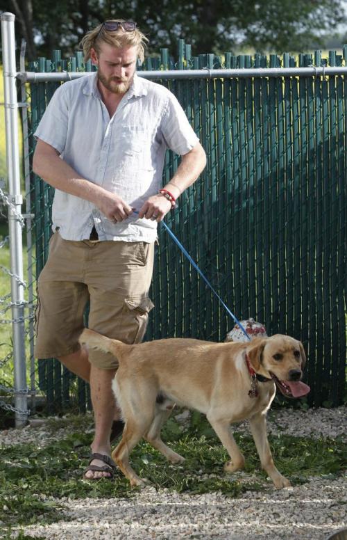Geordie Ross with Miles the dog. July 11, 2011 (BORIS MINKEVICH / WINNIPEG FREE PRESS)