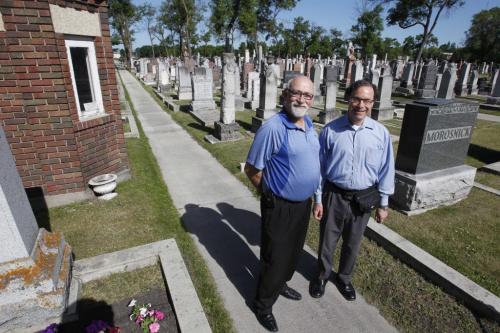 Ian Staniloff and Rabbi Alan Green pose for a photo at the Jewish faith cemetery on Armstrong. July 12, 2011 (BORIS MINKEVICH / WINNIPEG FREE PRESS)