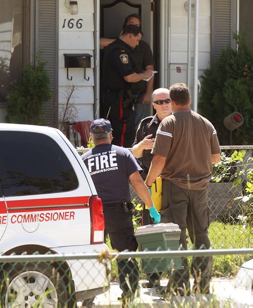 Heavy Police presence as well as memebers from the  Office of the Fire Commissioner at  166 Mighton Ave in Elmwood Tuesday- Officials from the Office of the Fire Commissioner were on hand as well as a heavy police presence investigating in the backlane - See Gabrielles story  July 12, 2011   (JOE BRYKSA / WINNIPEG FREE PRESS)