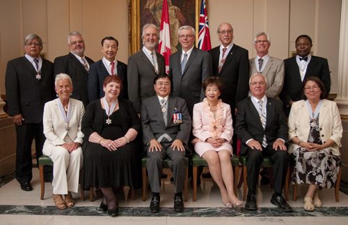 2011 recepients of the Order of Manitoba. From top Left, clockwise: Raymond (Sonny) Lavallee, Eugene Kostyra, Patrick Choy, Frederick (Fred) Penner, Premier Greg Selinger, Arthur DeFehr, James (Jim) Carr, Henry Idonije, [from bottom right to left] Kathy Mallett, Raymond Poirier, Her Honour Anita K. Lee, Lieutenant Governor Philip S. Lee, Rayleen De Luca, and Susan Lewis. July 12, 2011 (Hadas Parush / Winnipeg Free Press)