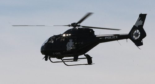 Winnipeg Police helicopter flies over fire scene on Nairne Ave to refuel nearby  July 13,  2011   (JOE BRYKSA / WINNIPEG FREE PRESS)