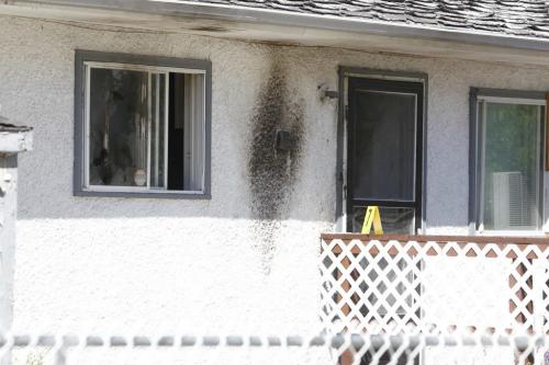166 Mighton. Scene of a possible firebombing. Police and fire investigate. July 12, 2011 (BORIS MINKEVICH / WINNIPEG FREE PRESS)