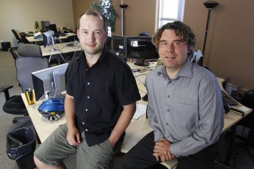 Dan Legal and Lance Schafer of LemonFree.Com pose for a photo in their Winnipeg office. July 13, 2011 (BORIS MINKEVICH / WINNIPEG FREE PRESS)