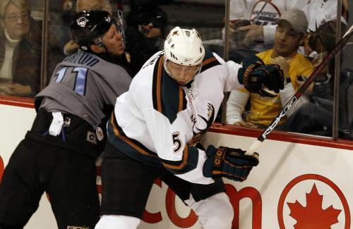 John Woods / Winnipeg Free Press / November 24, 2006 - 061124  - Moose Reagan Rome (5) takes out Admirals Paul Brown (11) in  first period AHL action in Winnipeg Nov 24/06.