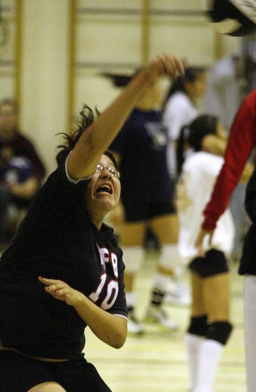 John Woods / Winnipeg Free Press / November 25, 2006 - 061125  - Briana Copenace of team Dapham spikes the ball in a playoff game at the 2006 Indigenous Volleyball Championship at Shamrock School in Winnipeg Saturday Nov 25/06.