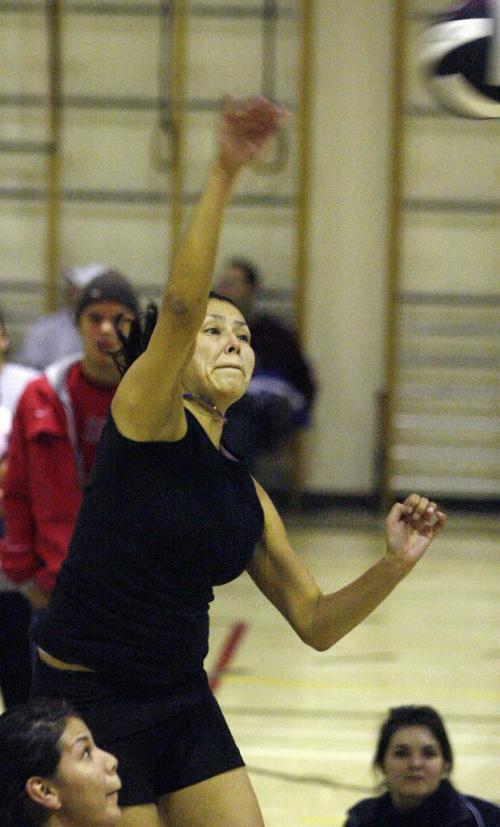 John Woods / Winnipeg Free Press / November 25, 2006 - 061125  - Denise Tom of team Dapham spikes the ball in a playoff game at the 2006 Indigenous Volleyball Championship at Shamrock School in Winnipeg Saturday Nov 25/06.