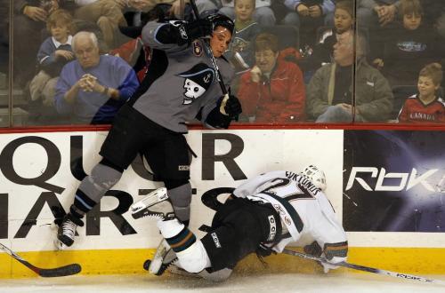 John Woods / Winnipeg Free Press / November 25, 2006 - 061125  - Moose Maxime Fortunus (27) is taken out of the play by Admirals Brandon Segal (12) in first period AHL action in Winnipeg Saturday Nov 25/06.