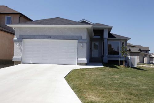 HOMES -26 Brookland Bay home is like 208 John Angus Drive, but with the landscaping done.  July 19, 2011 (BORIS MINKEVICH / WINNIPEG FREE PRESS)