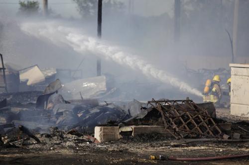 Firefighters from rural municipalities work on extinguishing a fire at Little Mountain Sports Park just north of Winnipeg, Thursday, July 21, 2011.  John Woods/Winnipeg Free Press