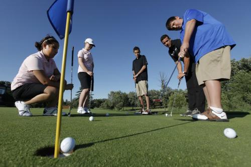 Elmwood high school students (L to R) Soleil Gallego, Kelly Kuzina, Matthew Chartrand and Jonathan Boyer are instructed by Rossmere Golf Club assistant professional Ryan Delbigio as part of the PGA of Manitoba's Innercity Youth Golf Program at Rossmere in Winnipeg, Thursday, July 21, 2011.  John Woods/Winnipeg Free Press