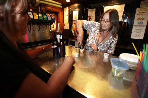 Debbie Slota serves beverages at the LaSalle Hotel in Winnipeg, Friday, July 22, 2011.  John Woods/Winnipeg Free Press