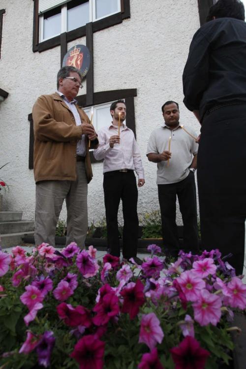 A group of Liberals sing Amazing Grace in front of the Norwegian consulate in Fort Richmond. July 24, 2011 (BORIS MINKEVICH / WINNIPEG FREE PRESS)