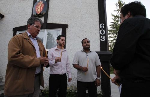 A group of Liberals sing Amazing Grace in front of the Norwegian consulate in Fort Richmond. July 24, 2011 (BORIS MINKEVICH / WINNIPEG FREE PRESS)