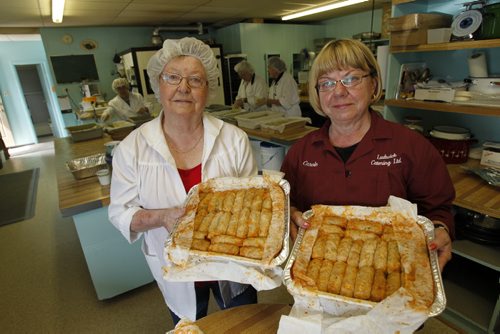 Rose Ludwick and her daughter Carole Aitkenhad pose with some delicious cabbage rolls they were making in the shop today. Ludwick's Catering. July 26, 2011 (BORIS MINKEVICH / WINNIPEG FREE PRESS) Folklorama Ukrainian.