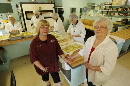 Rose Ludwick,r, and her daughter Carole Aitkenhad,l, pose with some delicious cabbage rolls they were making in the shop today. Ludwick's Catering. July 26, 2011 (BORIS MINKEVICH / WINNIPEG FREE PRESS) Folklorama Ukrainian.