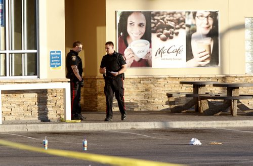 Winnipeg Police at the scene of a early Thursday morning shooting at the McDonald's Restaurant in the 1000 block of Notre Dame Avenue. Alex Paul story WAYNE GLOWACKI WINNIPEG FREE PRESS JULY 28 2011
