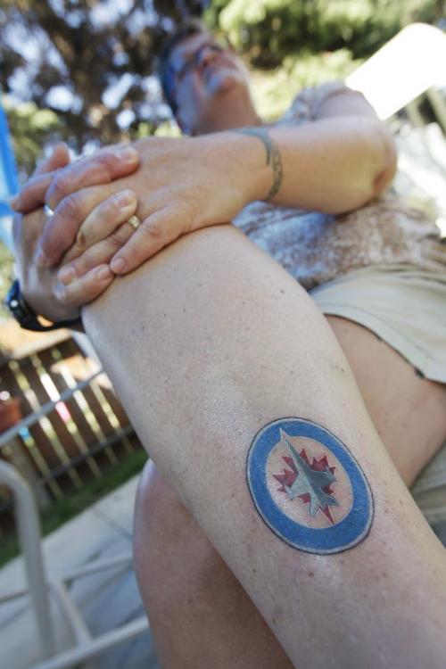 Heather Dea shows off her new Winnipeg Jets tattoo in Winnipeg, Thursday, July 28, 2011.  John Woods/Winnipeg Free Press