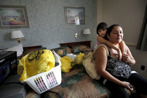 Five year old Haelynn hugs her mom Alycia Anderson moments before they leave their hotel room at the Marlborough Hotel that they have called home for over 3 months after being evacuated from Lake St. Martin due to flooding. Saturday Special - Melissa Martin's Flooding story. July 28, 2011 (RUTH BONNEVILLE / WINNIPEG FREE PRESS)