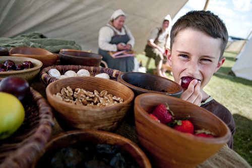 Leo Speary-Bedard, 11, of Winnipeg, eats traditional viking food during the Gimli Icelandic Festival of Manitoba, Friday. July 29, 2011 (HADAS PARUSH / WINNIPEG FREE PRESS)