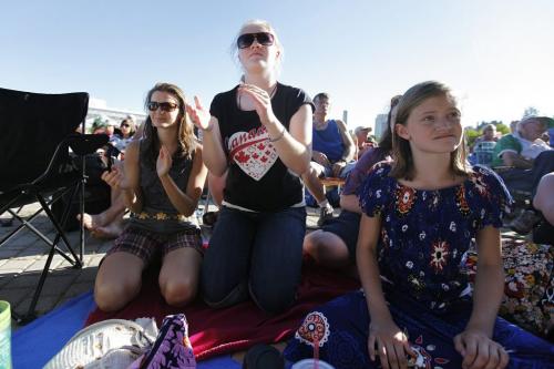 (LtoR) Katherine Wilgus, Maggie Rochester, and Annika Wilgus watch the show at the Folklorama kick off concert at the Forks Saturday, July 30, 2011.  John Woods/Winnipeg Free Press