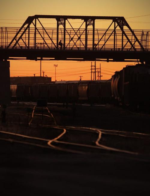 A cyclist crosses the Arlington bridge during a sunset Saturday, July 30, 2011.  John Woods/Winnipeg Free Press