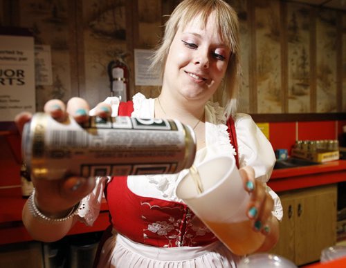 Amy Rempel pours a German beer for a guest at the German Pavilion on Charles Street, Sunday, July 31st, 2011. Today is the first day of Folklorama. (TREVOR HAGAN/WINNIPEG FREE PRESS)