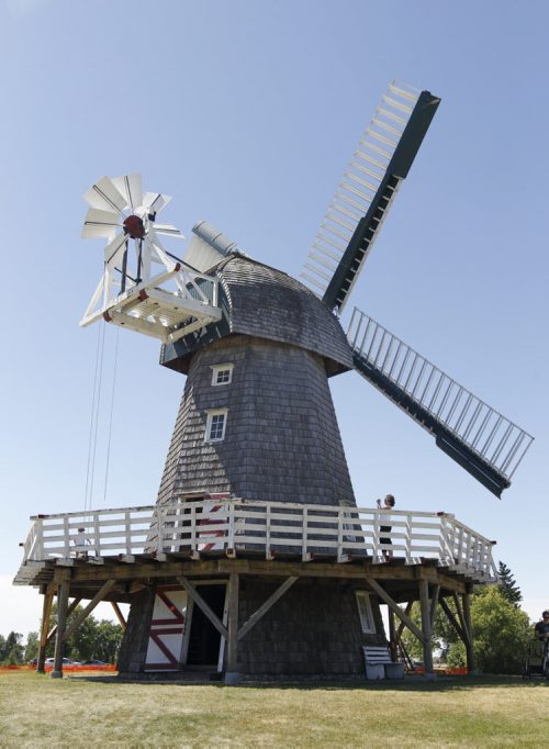 A visitor photographs the working windmill at the Mennonite Heritage Village in Steinbach, during Pioneer Days, Sunday, July 31st, 2011. (TREVOR HAGAN/WINNIPEG FREE PRESS)