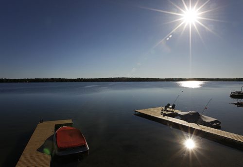 The sun rises over Gull Lake Manitoba, on a calm morning, Sunday, July 31st, 2011. (TREVOR HAGAN/WINNIPEG FREE PRESS)