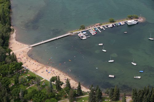 Brandon Sun 01082011 The beach, pier and marina in Wasagaming teems with life on the August Long Weekend Monday as hot weather continues to blanket southern Manitoba.   (Tim Smith/Brandon Sun)