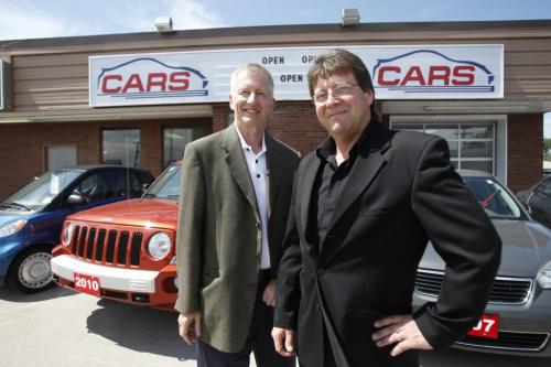 Terry Smith,L, the founder of Boyd Autobody is partner with Mark Bychowsky,R, a long-time car nut and auto retail professional in this (just opened) used car venture with a difference  no small print, no price haggling and a policy of full-on integrity.. August 3, 2011 (BORIS MINKEVICH / WINNIPEG FREE PRESS)