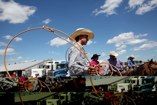 Brandon Sun 04082011 George Marcenko of Rockland, SK twirls his lasso while waiting to compete in the Tie Down Roping event on the first day of the 2011 Canadian High School Rodeo Finals in Virden, Man. on Thursday afternoon. The rodeo runs until Saturday. (Tim Smith/Brandon Sun)
