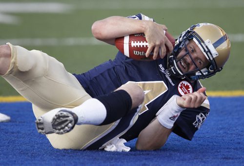 Buck Pierce falls into the endzone after scrambling long touchdown run late in the first half of CFL action at Canad Inns Stadium. The Bombers trail the Eskimos 13-12 after the first half. (TREVOR HAGAN/WINNIPEG FREE PRESS)
