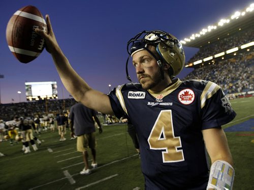 Bombers' QB, Buck Pierce salutes the crowd at Canad Inns Stadium after leading the team to a victory over the Eskimos. (TREVOR HAGAN/WINNIPEG FREE PRESS)