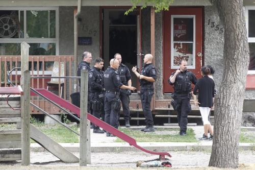 Police attend a standoff involving a man brandishing a gun at 1357 McDermott Avenue W in Winnipeg Saturday, August 6, 2011.  John Woods/Winnipeg Free Press