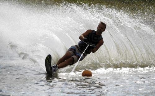 Craig Dueck practices some of his waterski cuts at the pond on Murdock Road. Waterski Manitoba is based out of there. He belongs to the club there and comes several times a week with his buddies to sharpen up his skills on the water. August 9, 2011 (BORIS MINKEVICH / WINNIPEG FREE PRESS)