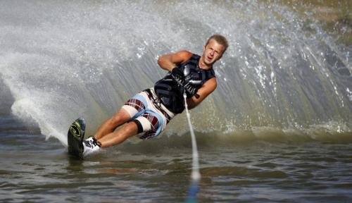 Craig Dueck practices some of his waterski cuts at the pond on Murdock Road. Waterski Manitoba is based out of there. He belongs to the club there and comes several times a week with his buddies to sharpen up his skills on the water. August 9, 2011 (BORIS MINKEVICH / WINNIPEG FREE PRESS)