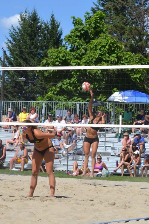 Action Photo of Womens Beach Volleyball Gold Medal Team WInners Front - Shanlee McLennan, Serving - Ozana Nikolic. From Western Canadian Summer Games in Kamloops BC.   Photo taken by Kristy Slough Winnipeg Free Press