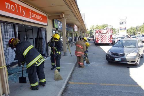 A MVC at the strip mall at 2091 Corydon. Molly Jacobs clothing store was crashed into by a small car. No word on injuries or cost of damage. August 10, 2011 (BORIS MINKEVICH / WINNIPEG FREE PRESS)