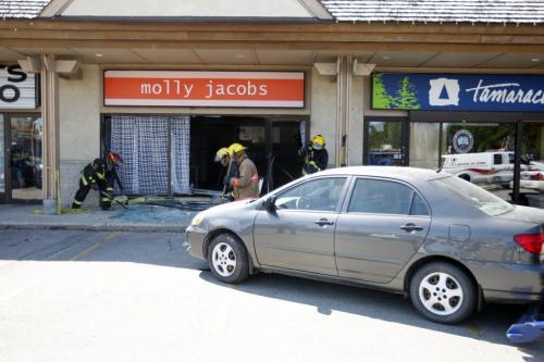 A MVC at the strip mall at 2091 Corydon. Molly Jacobs clothing store was crashed into by a small car. No word on injuries or cost of damage. August 10, 2011 (BORIS MINKEVICH / WINNIPEG FREE PRESS)