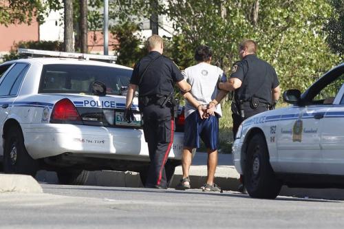 Police detain a man for panhandling on Higgins at Main Street in Winnipeg Saturday, August 13, 2011. John Woods/Winnipeg Free Press