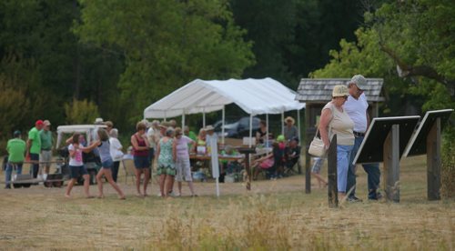 Brandon Sun Visitors at the Criddle/Vane Homestead Provincial Heritage Park take in the sites at the St. Alban's Picnic held on Sunday afternoon. (Bruce Bumstead/Brandon Sun)