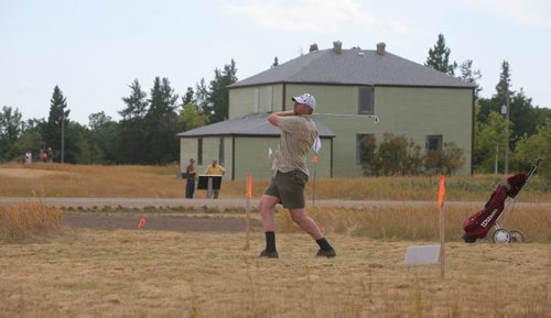 Brandon Sun Robert Smith of Winnipeg, tees off on the fourth hole of the re-created nine-hole golf course, thought to one of the first in Manitoba, at the Criddle/Vane Homestead heritage park on Sunday afternoon. (Bruce Bumstead/Brandon Sun)